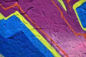 Background image of the wall decorated with colorful abstract graffiti. Street art concept photo