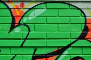 Street art. Colorful graffiti on the wall. Fragment for background. Abstract detail of a graffiti photo