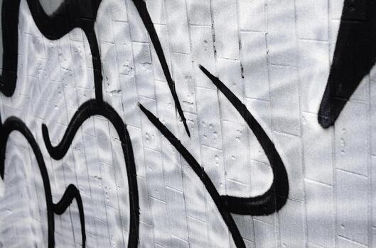 A fragment of a graffiti pattern, applied to a wall of cold tiles, which is covered with a fine condensate. The concept of street art in inappropriate weather photo