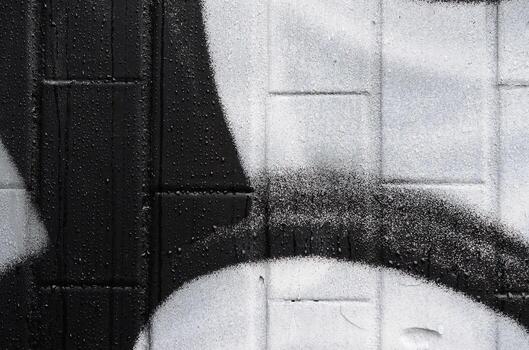 A fragment of a graffiti pattern, applied to a wall of cold tiles, which is covered with a fine condensate. The concept of street art in inappropriate weather photo