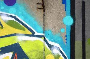 Fragment of colored street art graffiti paintings with contours and shading close up photo