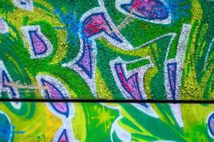 Fragment of colored street art graffiti paintings with contours and shading close up photo