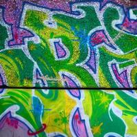 Fragment of colored street art graffiti paintings with contours and shading close up photo