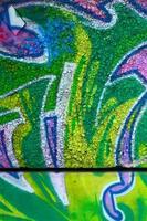 Fragment of colored street art graffiti paintings with contours and shading close up photo