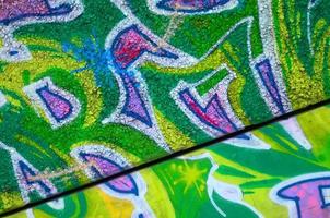 Fragment of colored street art graffiti paintings with contours and shading close up photo