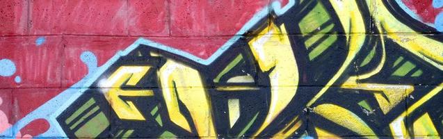 Fragment of colored street art graffiti paintings with contours and shading close up photo