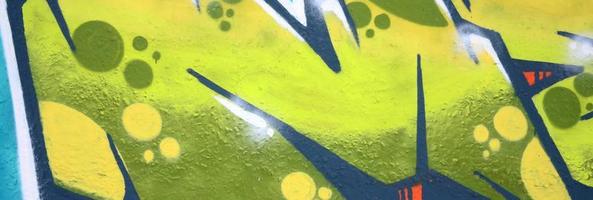 Fragment of colored street art graffiti paintings with contours and shading close up photo