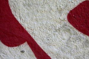 Street art. Abstract background image of a fragment of a colored graffiti painting in chrome and red tones photo