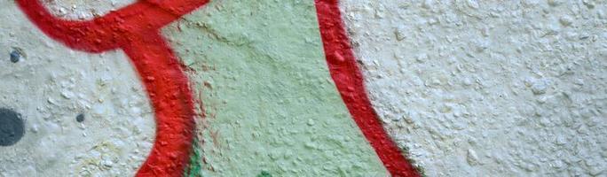 Street art. Abstract background image of a fragment of a colored graffiti painting in chrome and red tones photo