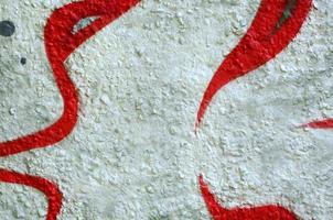 Street art. Abstract background image of a fragment of a colored graffiti painting in chrome and red tones photo