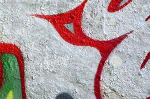 Street art. Abstract background image of a fragment of a colored graffiti painting in chrome and red tones photo
