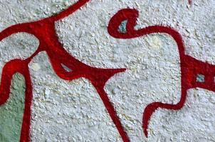 Street art. Abstract background image of a fragment of a colored graffiti painting in chrome and red tones photo