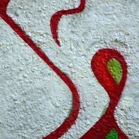 Street art. Abstract background image of a fragment of a colored graffiti painting in chrome and red tones photo