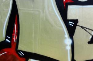 Street art. Abstract background image of a fragment of a colored graffiti painting in chrome and red tones photo