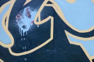 Street art. Abstract background image of a fragment of a colored graffiti painting in dark grey and red tones photo