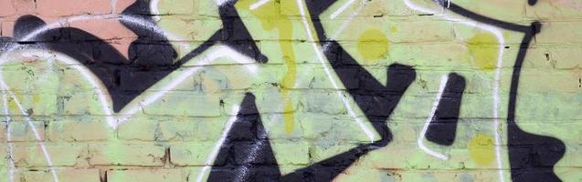 Fragment of colored street art graffiti paintings with contours and shading close up photo