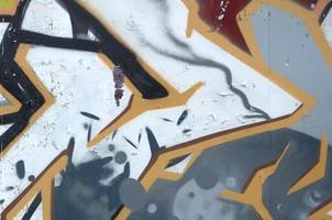 Fragment of colored street art graffiti paintings with contours and shading close up photo