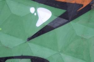 Fragment of colored street art graffiti paintings with contours and shading close up photo