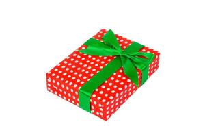 Christmas or other holiday handmade present in red paper with Green ribbon. Isolated on white background, top view. thanksgiving Gift box concept photo