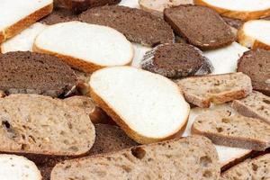 Sliced white and brown loaf of bread photo