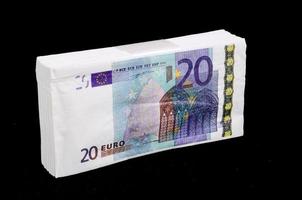 Euro cash on black background photo