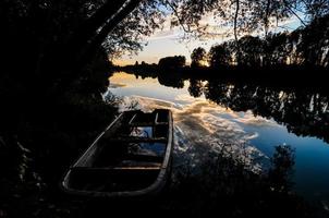 Boat by the forest photo