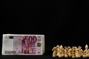 Chess pieces with cash photo