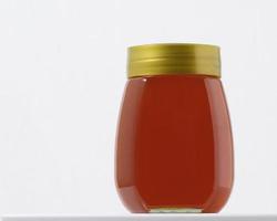 Honey jar on white background photo