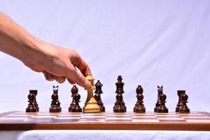 Hand playing chess photo