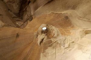 Cave in the chalk cliffs in southern Israel. photo