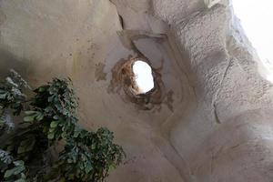 Cave in the chalk cliffs in southern Israel. photo