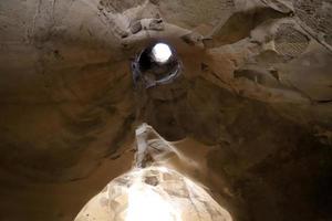 Cave in the chalk cliffs in southern Israel. photo