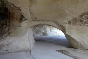 Cave in the chalk cliffs in southern Israel. photo