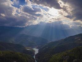 perfect filtering of the sun's rays through the clouds photo