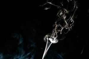 Smoke effect texture. Isolated background. Black and dark backdrop. Smokey fire and mistic effect. photo