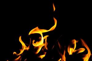 Fire flame texture. Burning material backdrop. Burn effect pattern. Blaze and torch wallpaper. Heat and haze backdrop. photo