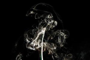 Smoke effect texture. Isolated background. Black and dark backdrop. Smokey fire and mistic effect. photo