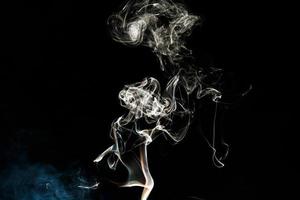 Smoke effect texture. Isolated background. Black and dark backdrop. Smokey fire and mistic effect. photo