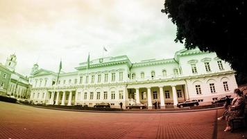 VILNIUS, LITHUANIA - JULY 1, 2021. Static timelapse footage of Presidential Palace of Lithuania on cloudy day photo