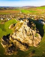 Aerial top view Kveshi fortress with pathway and cross on top. Historical and cultural heritage n Georgia. photo