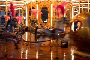 Blurry vintage merry-go-round carousel. Retro design, nostalgia concept. photo