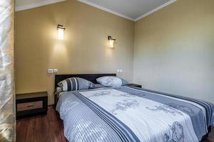 interior of cheapest bedroom in studio apartments or hostel. photo