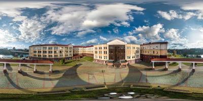 aerial full seamless spherical hdri 360 panorama view above over a medieval castle with columns and historic buildings in equirectangular projection. photo