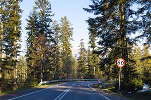 Travelling by car. The track in the mountains through the forest. Polish Tatras. photo