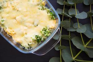 casserole with broccoli, cheese and cream, close-up. photo