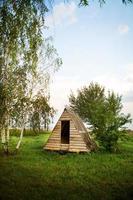 wooden house near the lake in the form of a triangle - perfect holiday on nature photo