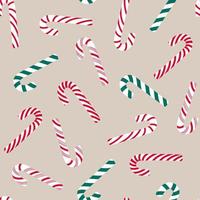 Christmas seamless pattern with candy canes on beige background. Vector background for wrapping paper, fabric print, greeting cards design.