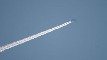 Widebody airplane flying at high altitude with contrail video