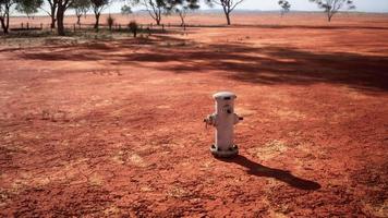 old rusted fire hydrant in desert photo