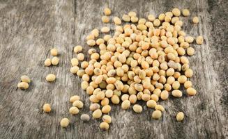soybeans or soya beans grain seed on rustic wood background photo